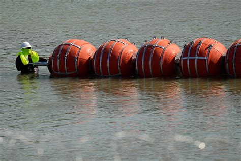 Justice Department sues to force Texas to remove floating barriers in Rio Grande